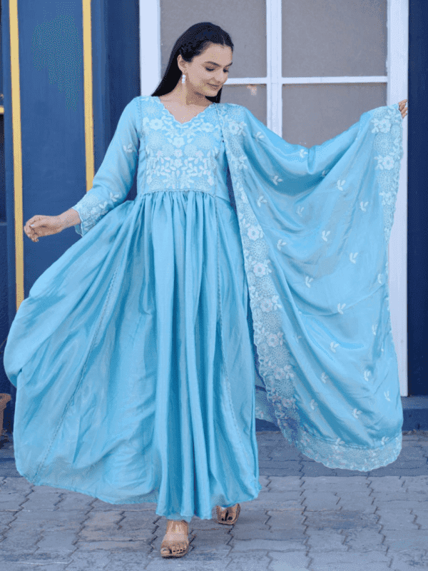 Elegant Chinon gown featuring intricate embroidery, a soft micro inner, elastic-stitched pants, and a beautifully embroidered 2.2-meter dupatta.