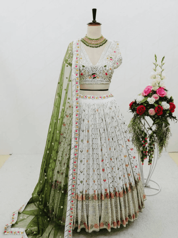 A stunning lehenga choli set made from heavy fox georgette with intricate Siqwans embroidery, complemented by a soft net dupatta, perfect for weddings and festive occasions.