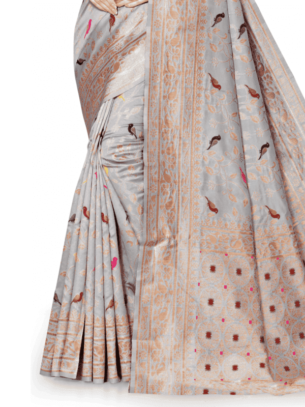 Soft Lichi silk saree features a golden zari woven pallu and border with beautiful motifs, complemented by a designer brocade silk blouse piece.