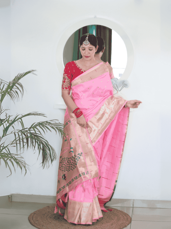 Soft Paithani silk saree with Meenakari zari weaving, tassels on the pallu, and designer silk blouse piece, ideal for festive traditional wear.