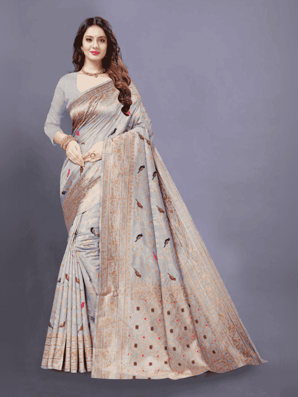 Soft Lichi silk saree features a golden zari woven pallu and border with beautiful motifs, complemented by a designer brocade silk blouse piece.