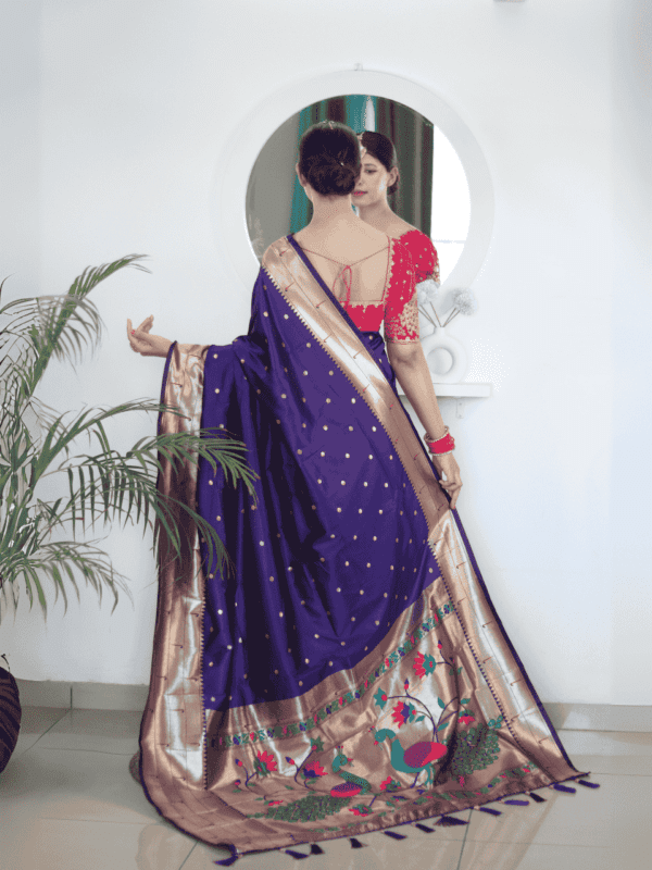 Soft Paithani silk saree with Meenakari zari weaving, tassels on the pallu, and designer silk blouse piece, ideal for festive traditional wear.