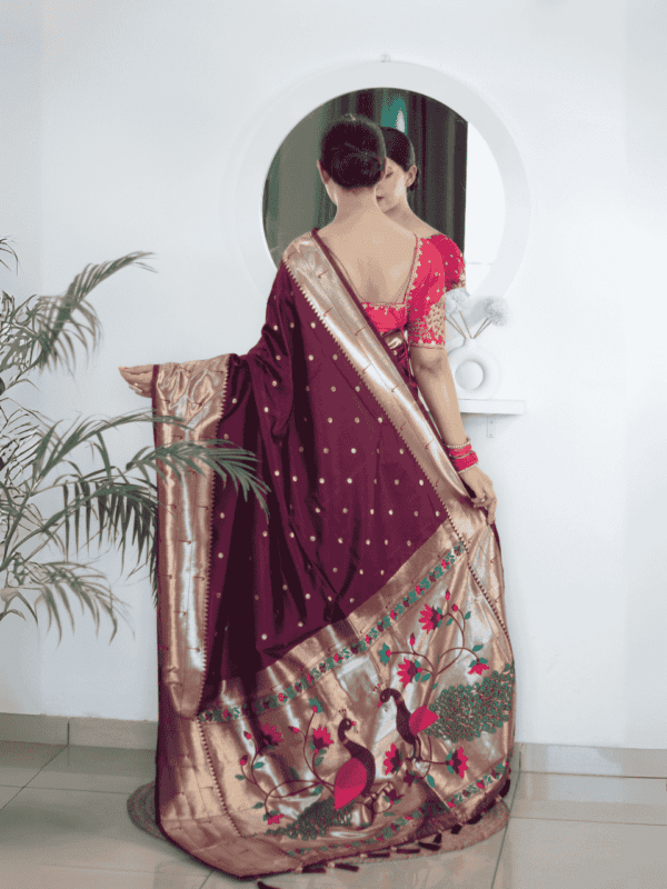 Soft Paithani silk saree with Meenakari zari weaving, tassels on the pallu, and designer silk blouse piece, ideal for festive traditional wear.