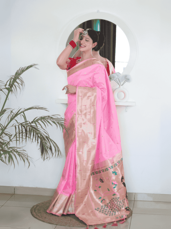 Soft Paithani silk saree with Meenakari zari weaving, tassels on the pallu, and designer silk blouse piece, ideal for festive traditional wear.