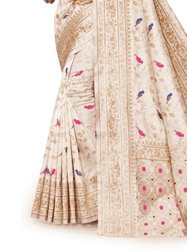 Soft Lichi silk saree features a golden zari woven pallu and border with beautiful motifs, complemented by a designer brocade silk blouse piece.