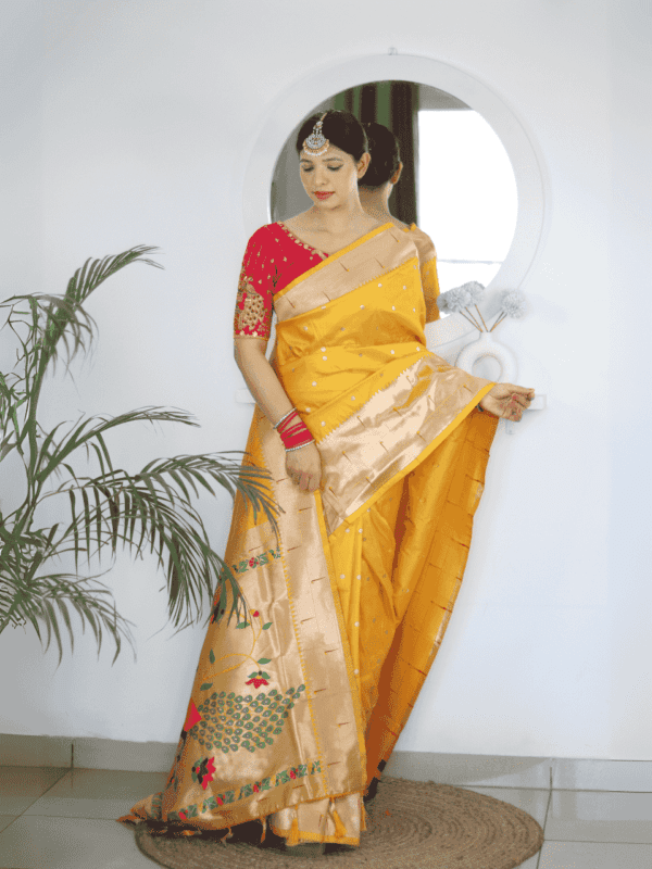 Soft Paithani silk saree with Meenakari zari weaving, tassels on the pallu, and designer silk blouse piece, ideal for festive traditional wear.