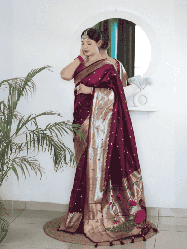 Soft Paithani silk saree with Meenakari zari weaving, tassels on the pallu, and designer silk blouse piece, ideal for festive traditional wear.