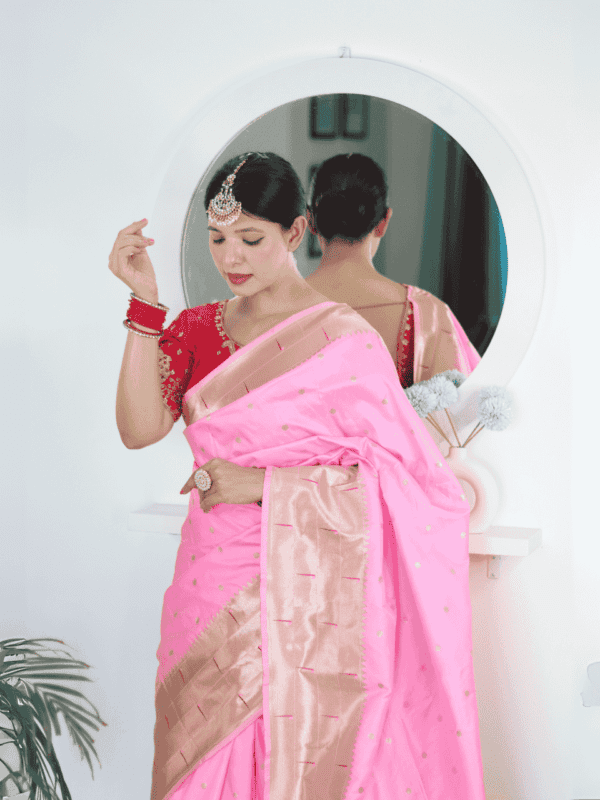 Soft Paithani silk saree with Meenakari zari weaving, tassels on the pallu, and designer silk blouse piece, ideal for festive traditional wear.