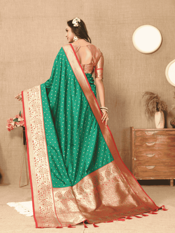 Elegant soft silk saree with detailed zari weaving, contrast pallu border, tassels at the end, and a brocade silk blouse piece, perfect for special occasions.