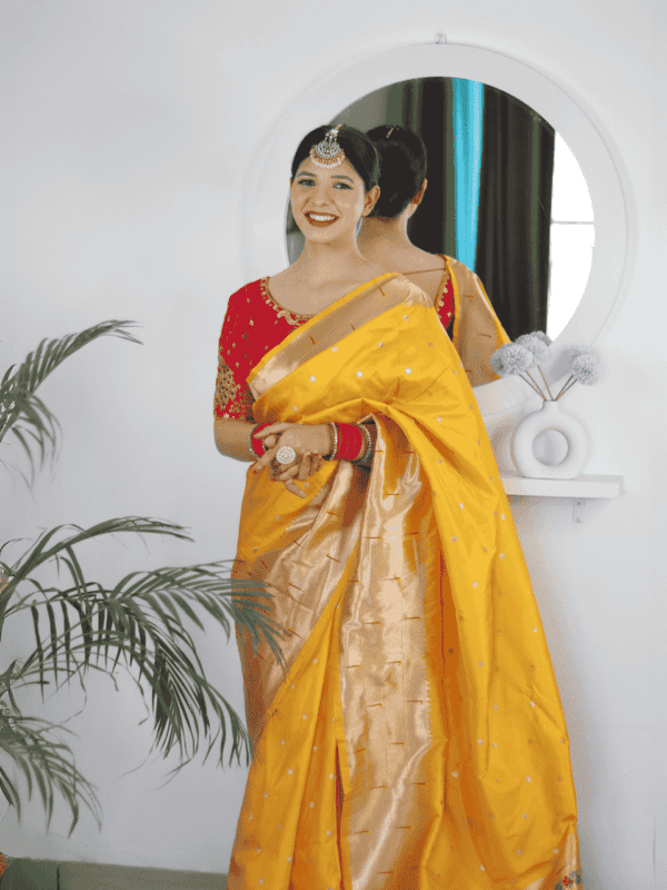 Soft Paithani silk saree with Meenakari zari weaving, tassels on the pallu, and designer silk blouse piece, ideal for festive traditional wear.