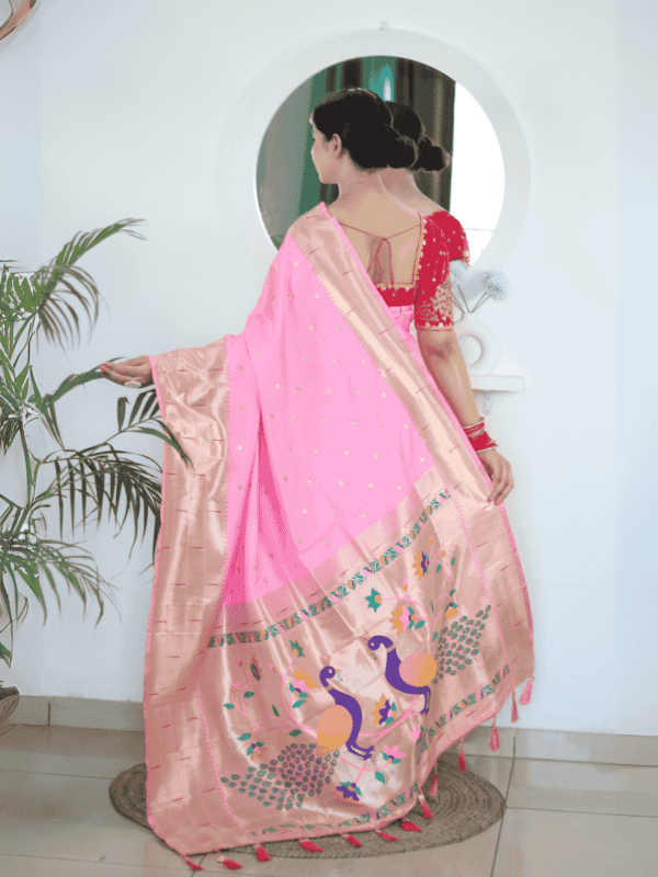 Soft Paithani silk saree with Meenakari zari weaving, tassels on the pallu, and designer silk blouse piece, ideal for festive traditional wear.