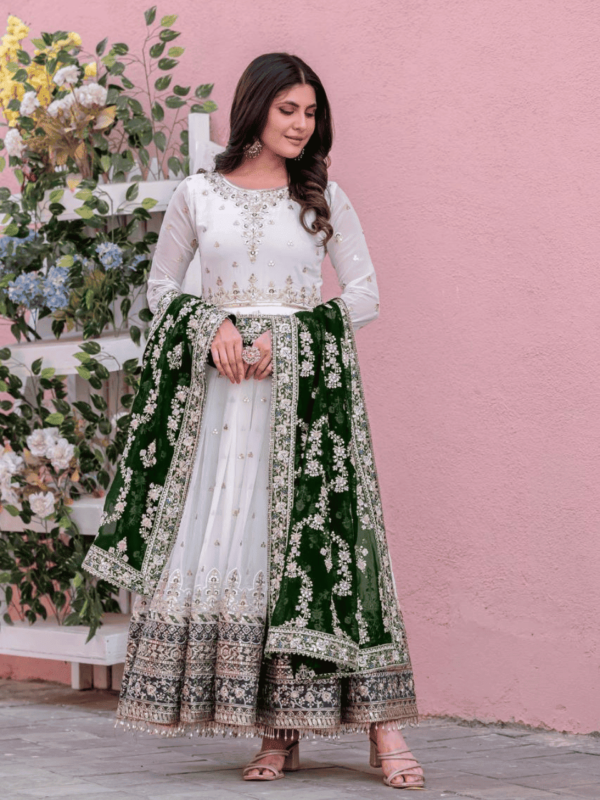 An elegant faux georgette gown with embroidery, sequin work, and a matching dupatta, paired with a micro cotton bottom, ideal for festive and party wear.