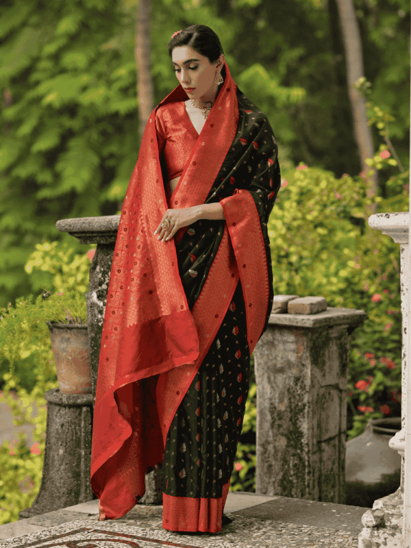 Luxurious Banarasi silk saree with a contrast copper zari border, intricate two-tone zari buttis, meena detailing, and a rich woven pallu, paired with a brocade blouse.