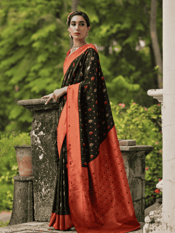 Luxurious Banarasi silk saree with a contrast copper zari border, intricate two-tone zari buttis, meena detailing, and a rich woven pallu, paired with a brocade blouse.