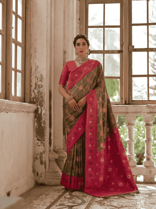 Exquisite Banarasi silk saree with a contrast zari weaving border, intricate two-tone zari jal, meena highlights, and a richly woven pallu with tassels.