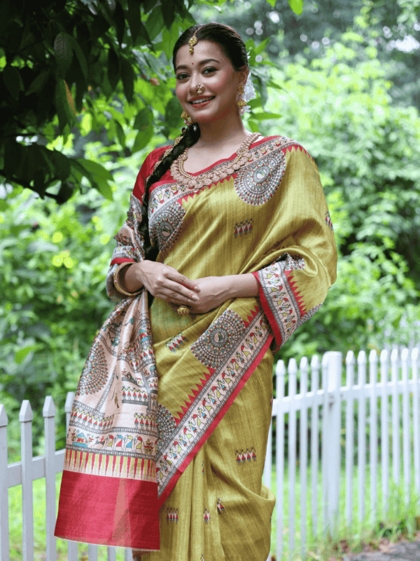 Soft Tussar Silk Saree with Madhubani prints, a Warli-printed contrast pallu, a unique contrast border, and a matching contrast blouse piece.