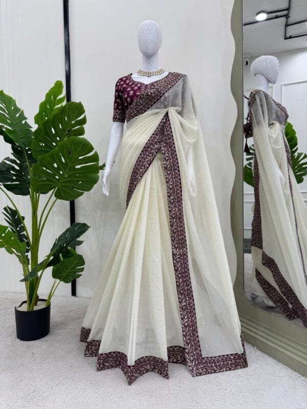 This Designer Crunchy Silk Saree with thread and sequence work and a Mono Benglori Silk blouse offers a timeless, elegant look for weddings and special occasions.