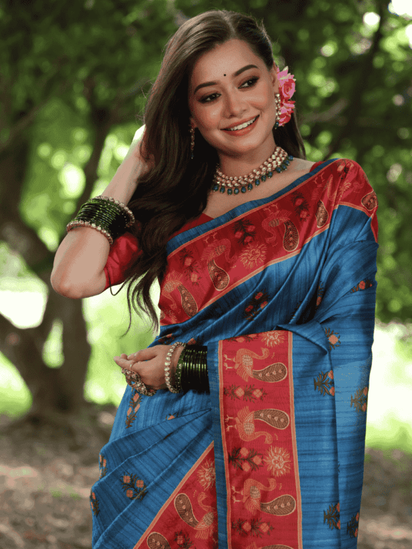 Soft Tussar Silk Saree adorned with elegant peacock prints, a traditional printed pallu, a contrast border, and a complementing contrast blouse piece.