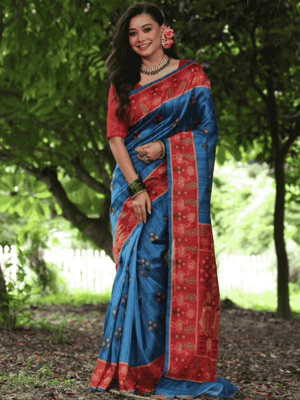 Soft Tussar Silk Saree adorned with elegant peacock prints, a traditional printed pallu, a contrast border, and a complementing contrast blouse piece.