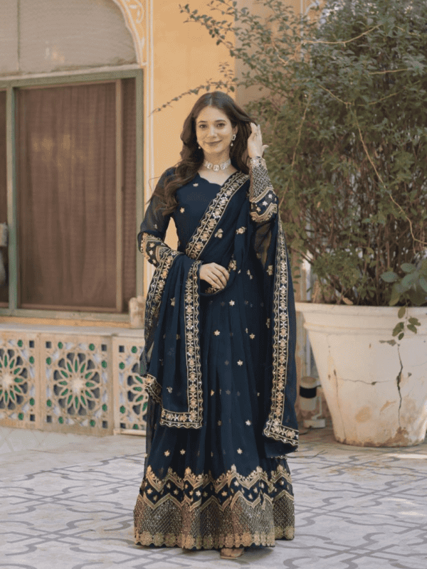 An exquisite faux blooming georgette gown with detailed zari and sequins embroidery, featuring a 3.5-meter flair, full sleeves, and a fancy neckline, paired with a matching embroidered dupatta.