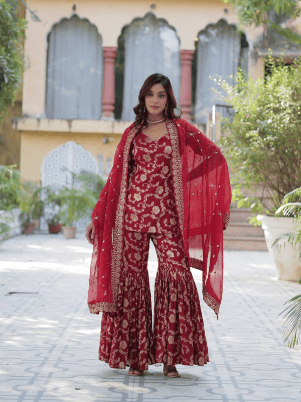 Viscose Georgette Jacquard Gharara set with a designer kurti, elastic waist gharara, and a sequined embroidered Russian silk dupatta. Available in three vibrant colors.