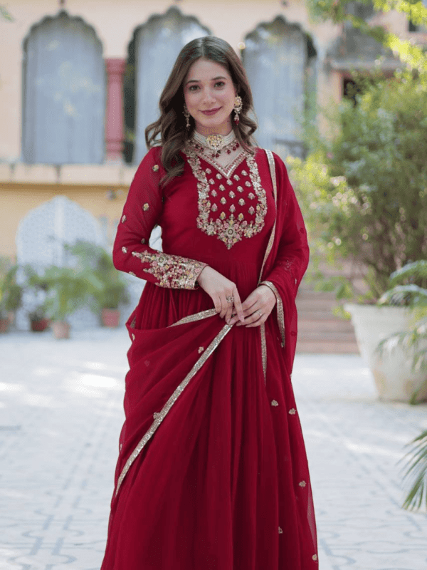 An elegant faux blooming georgette gown with rich sequins embroidery, full sleeves, a fancy V-neck, and a beautifully embroidered lace dupatta. Available in Maroon and Pink.