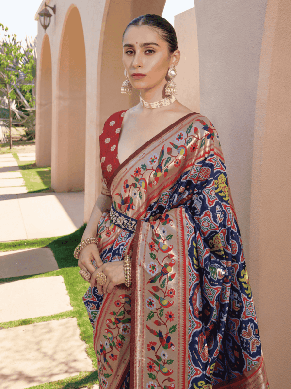 Exquisite Banarasi soft silk saree with detailed Meena and zari weaving, a Paithani-inspired border, a grand pallu, and elegant colorful lace.