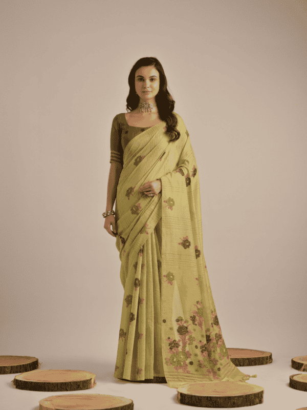 Traditional Muga Cotton saree with vibrant floral motif weaving, elegant buttas, and detailed lining, complemented by a contrast blouse and tassels.