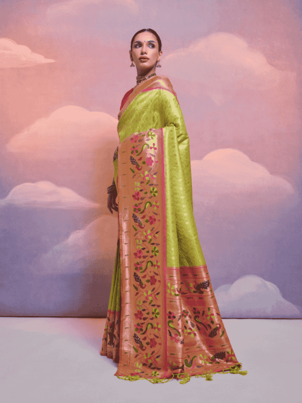 Exquisite Banarasi soft silk saree with Kanjivaram-inspired weaving, a contrast border, a grand zari pallu, fancy tassels, and a stylish contrast blouse piece.