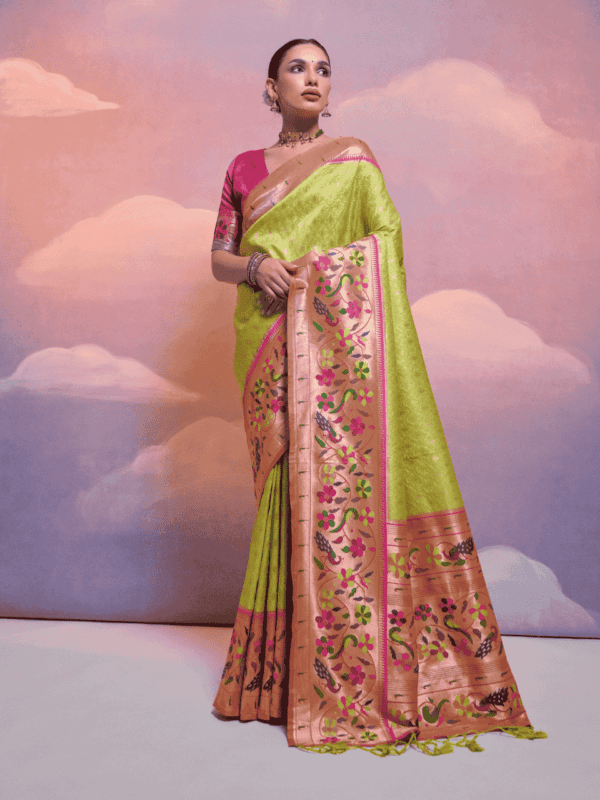 Exquisite Banarasi soft silk saree with Kanjivaram-inspired weaving, a contrast border, a grand zari pallu, fancy tassels, and a stylish contrast blouse piece.