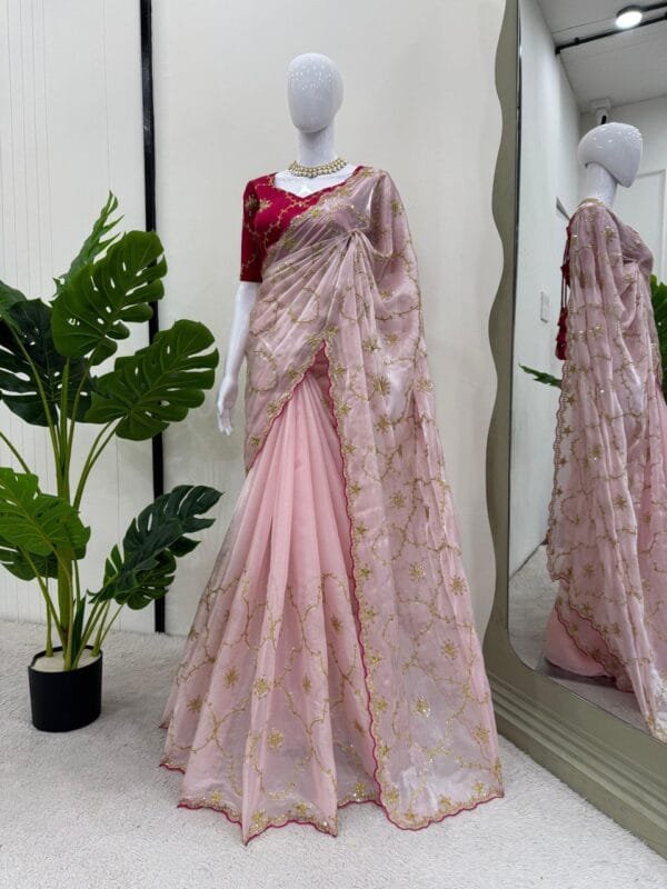 This Designer Zimmy Chu Saree with thread & sequence work and Mono Benglori Silk blouse with front and back detailing is a perfect choice for special occasions and festivals.