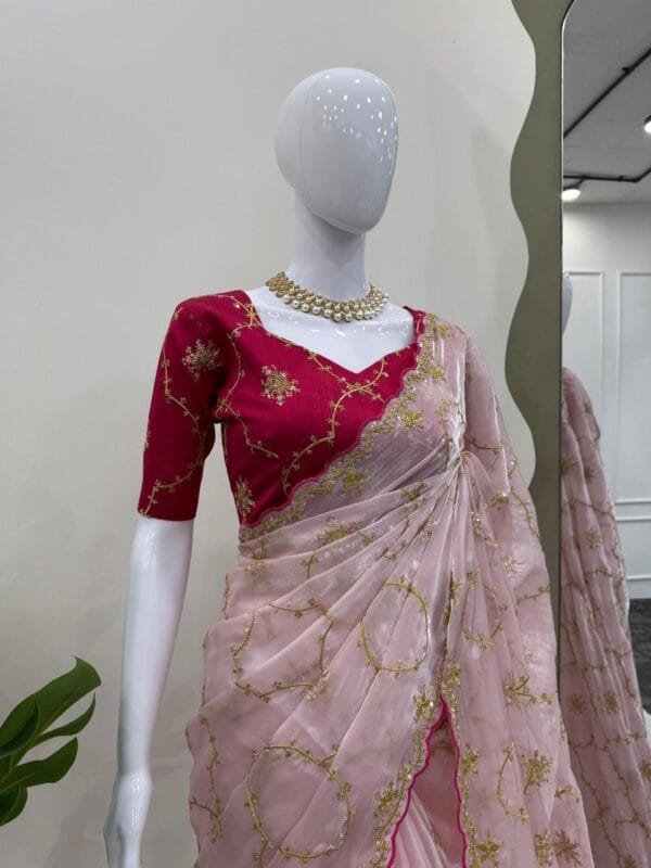 This Designer Zimmy Chu Saree with thread & sequence work and Mono Benglori Silk blouse with front and back detailing is a perfect choice for special occasions and festivals.