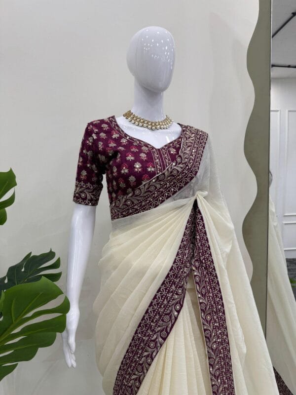 This Designer Crunchy Silk Saree with thread and sequence work and a Mono Benglori Silk blouse offers a timeless, elegant look for weddings and special occasions.