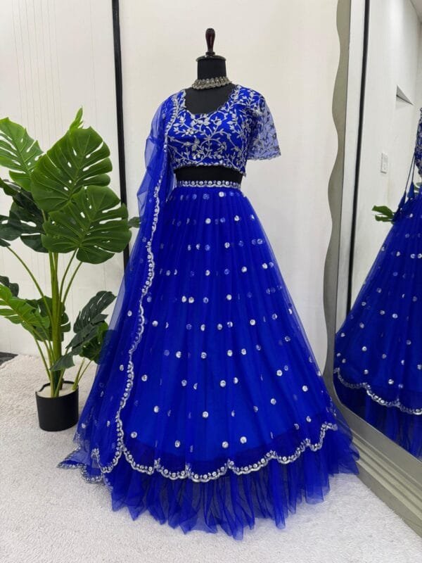 A heavy boutique collection lehenga with faux georgette fabric, thread and sequence work, featuring a semi-stitched lehenga, unstitched choli, and butterfly net dupatta.