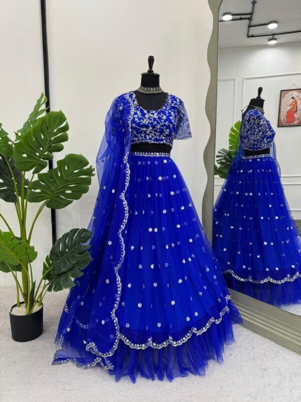 A heavy boutique collection lehenga with faux georgette fabric, thread and sequence work, featuring a semi-stitched lehenga, unstitched choli, and butterfly net dupatta.