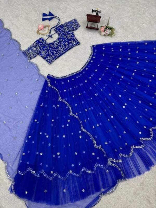 A heavy boutique collection lehenga with faux georgette fabric, thread and sequence work, featuring a semi-stitched lehenga, unstitched choli, and butterfly net dupatta.