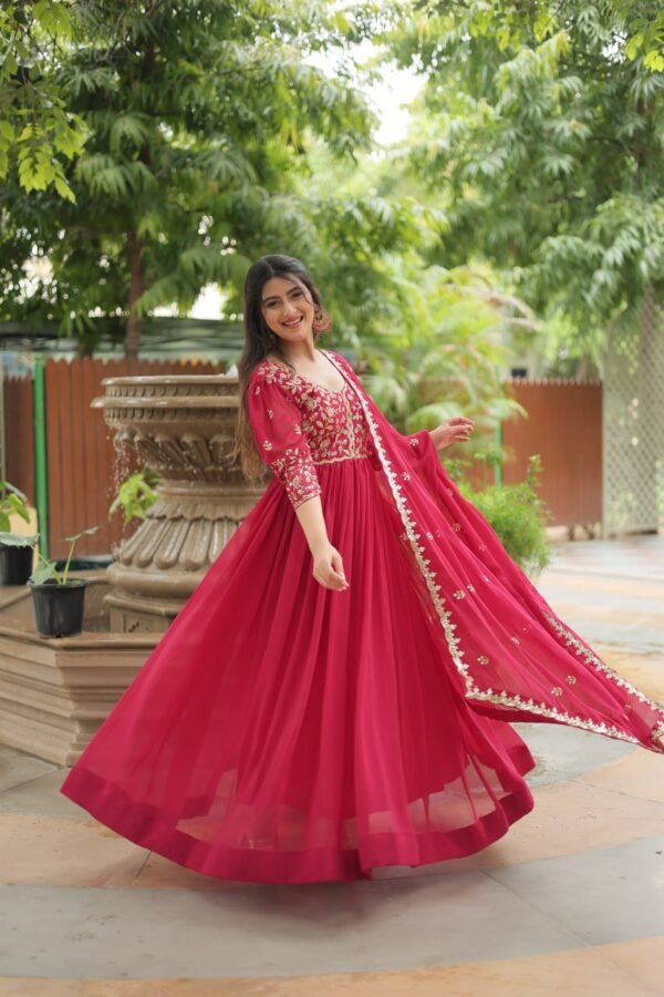 A breathtaking pink faux blooming georgette gown with puff sleeves, intricate sequins embroidery, and a round neckline, complemented by a stunning Arco-cut embroidered dupatta.