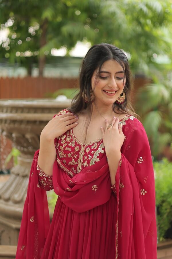 A breathtaking pink faux blooming georgette gown with puff sleeves, intricate sequins embroidery, and a round neckline, complemented by a stunning Arco-cut embroidered dupatta.