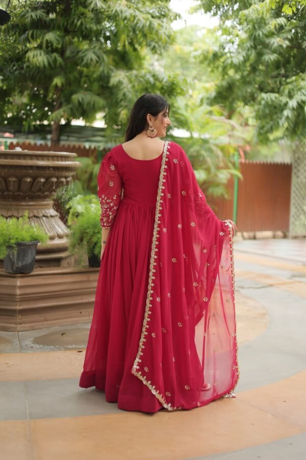 A breathtaking pink faux blooming georgette gown with puff sleeves, intricate sequins embroidery, and a round neckline, complemented by a stunning Arco-cut embroidered dupatta.