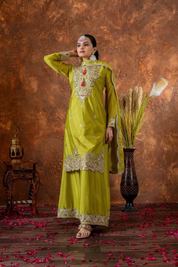 A luxurious designer Chinon Silk party wear set featuring a finely embroidered top, palazzo with an elastic waistband, and a dupatta with intricate cutwork. The soft micro cotton lining ensures all-day comfort, while the 3mm sequence and dori embroidery add a rich and elegant touch, making it perfect for special occasions.