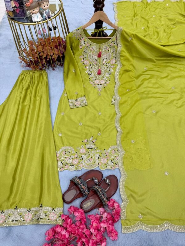 A luxurious designer Chinon Silk party wear set featuring a finely embroidered top, palazzo with an elastic waistband, and a dupatta with intricate cutwork. The soft micro cotton lining ensures all-day comfort, while the 3mm sequence and dori embroidery add a rich and elegant touch, making it perfect for special occasions.