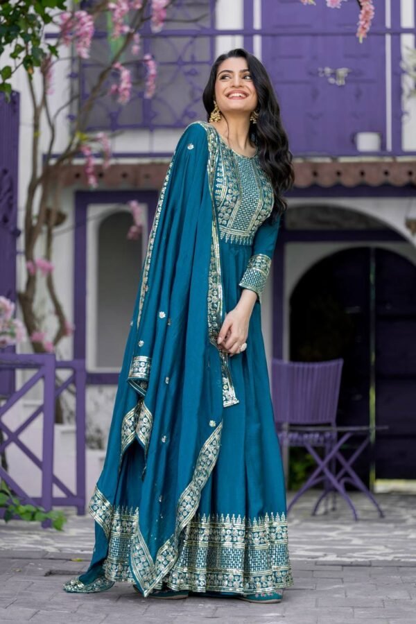 designer party wear gown crafted from heavy Chinon silk, featuring 5mm embroidery sequence work and full sleeves, paired with an embroidered dupatta.