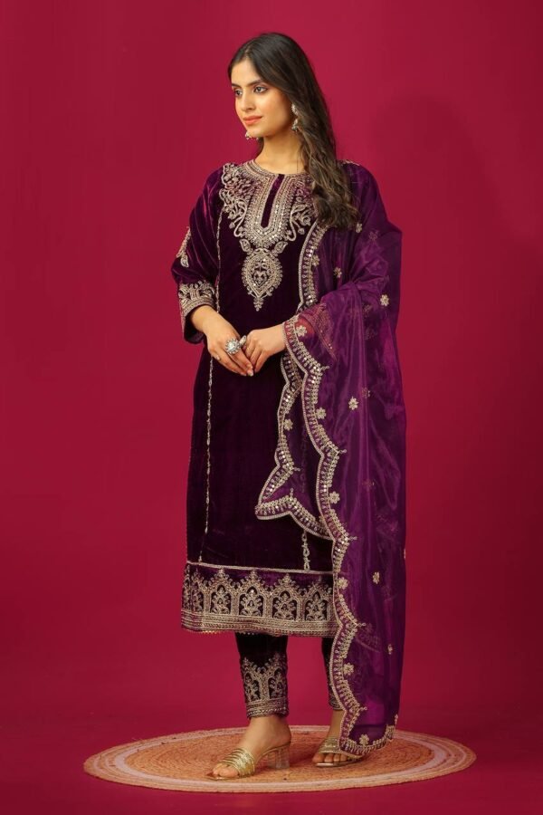 A stylish ethnic set with embroidered top, bottom, and dupatta in heavy Chinnon silk, ideal for traditional events or celebrations.