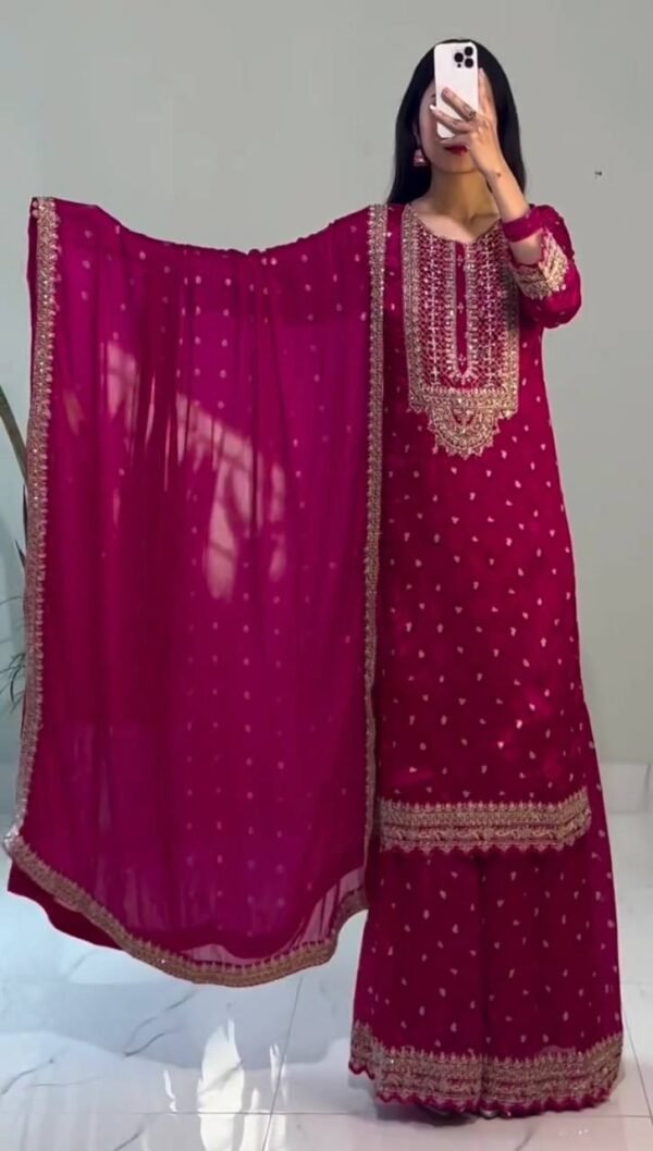 A stylish and luxurious embroidered Chinon silk top, flared sharara, and dupatta set with lace borders, ideal for festive and special occasions.