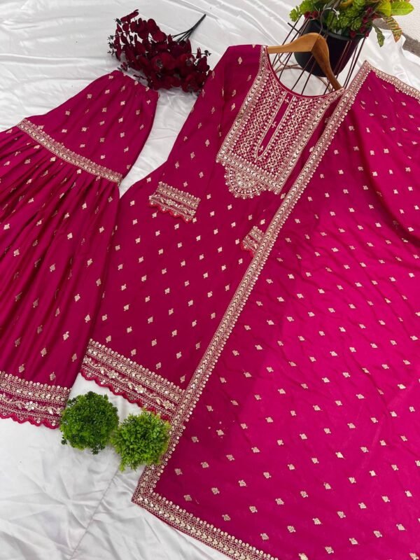 A stylish and luxurious embroidered Chinon silk top, flared sharara, and dupatta set with lace borders, ideal for festive and special occasions.