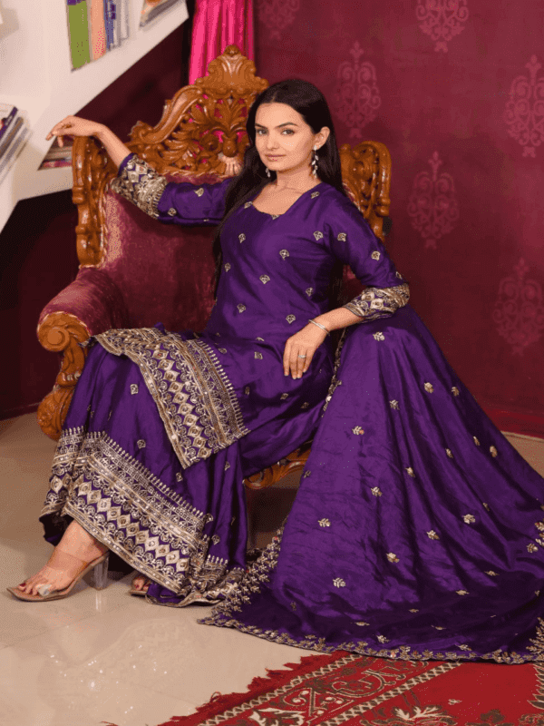 An elegant Chinon suit with intricate sequence embroidery, paired with a fully stitched sharara and a matching 2.2-meter dupatta, ideal for festive wear.