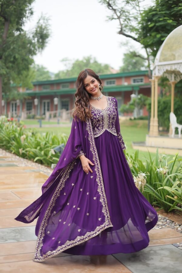 A stunning faux blooming gown with sequins and zari embroidery, paired with a faux georgette dupatta featuring a rich embroidered lace border. Available in Red and Purple.