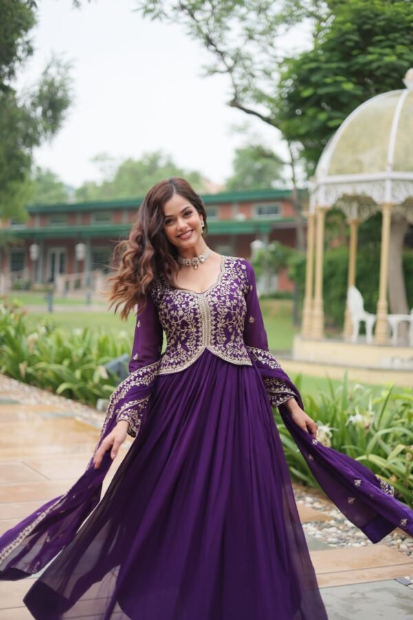 A stunning faux blooming gown with sequins and zari embroidery, paired with a faux georgette dupatta featuring a rich embroidered lace border. Available in Red and Purple.