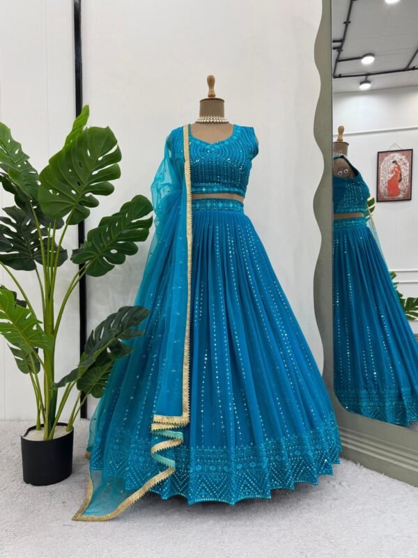 Faux georgette lehenga with sequins, cancan flair, unstitched blouse, and butterfly net dupatta with lace border.