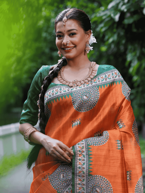 Soft Tussar Silk Saree with Madhubani prints, a Warli-printed contrast pallu, a unique contrast border, and a matching contrast blouse piece.